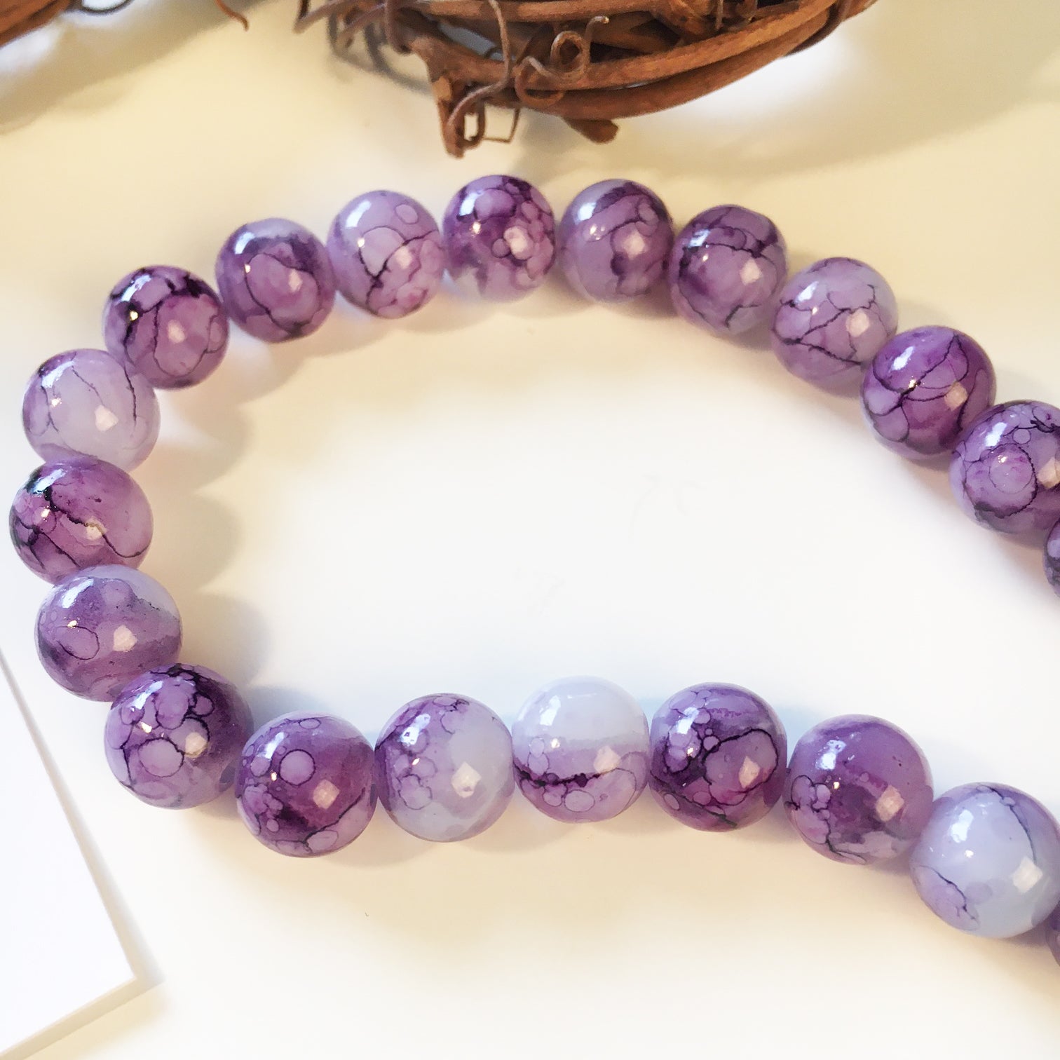 Glaspärlor 8,5-9mm Lila Swirl, 20st