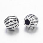 Små Bicone Metallpärlor Distanspärlor 4x4,5mm Antiksilver, 10st