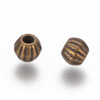 Små Bicone Metallpärlor Distanspärlor 4x4,5mm Antikbrons, 10st