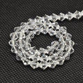Facetterade Biconformade Glaspärlor 6x6mm Klara Transparenta, 1 sträng (ca44st)