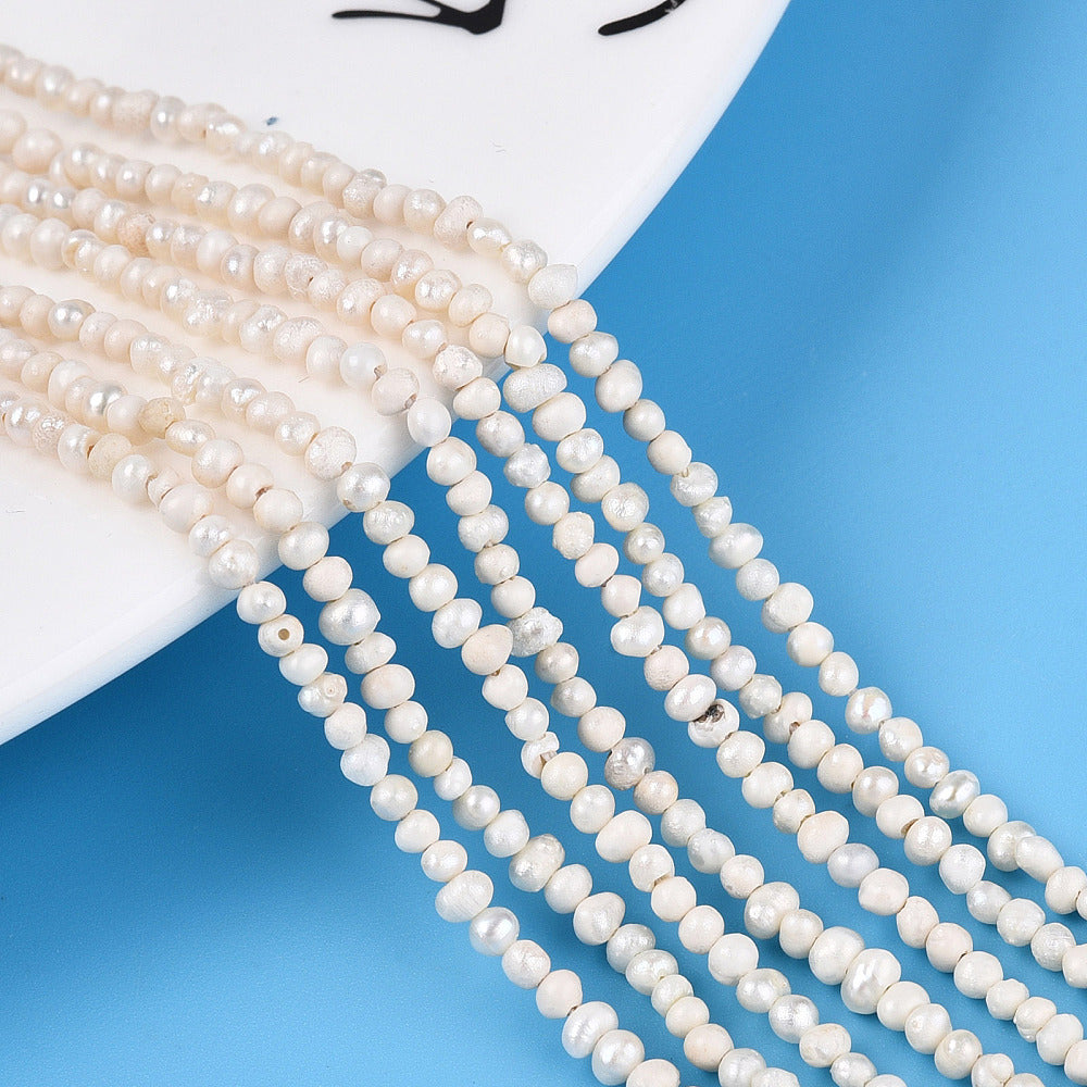 Äkta Sötvattenpärlor Pyttesmå 1,5-2,5mm x 1,5-4,5mm Beige Potatisformade, 1 sträng (ca 180st)