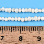 Äkta Sötvattenpärlor Pyttesmå 1,5-2,5mm x 1,5-4,5mm Beige Potatisformade, 1 sträng (ca 180st)