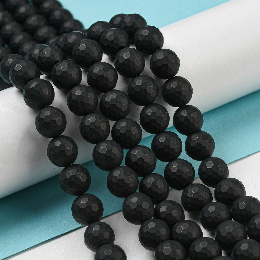 Svart onyx facetterade pärlor frostade runda 8 mm, 1 sträng (ca 38cm)
