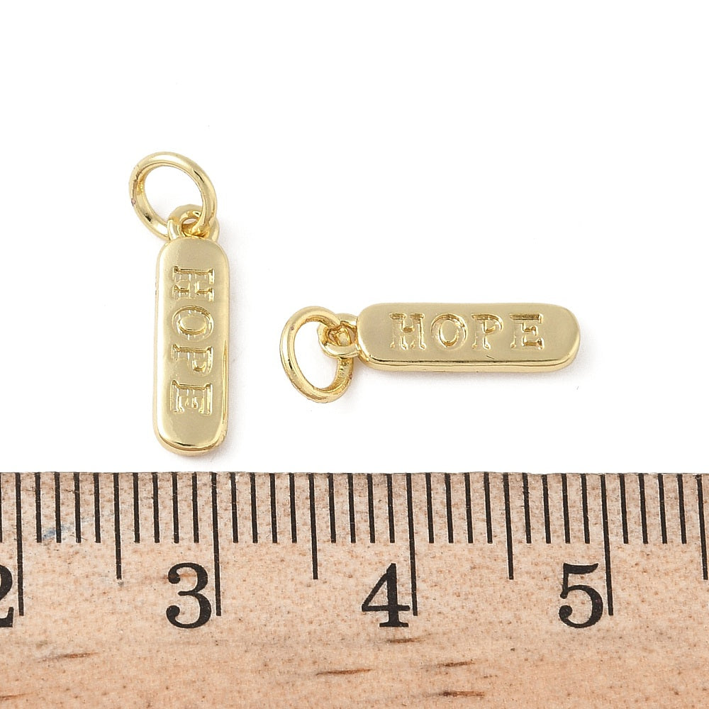 Mässingsberlock med bindring 4x14mm och text Hope på båda sidor 18K guldpläterad, 1 st