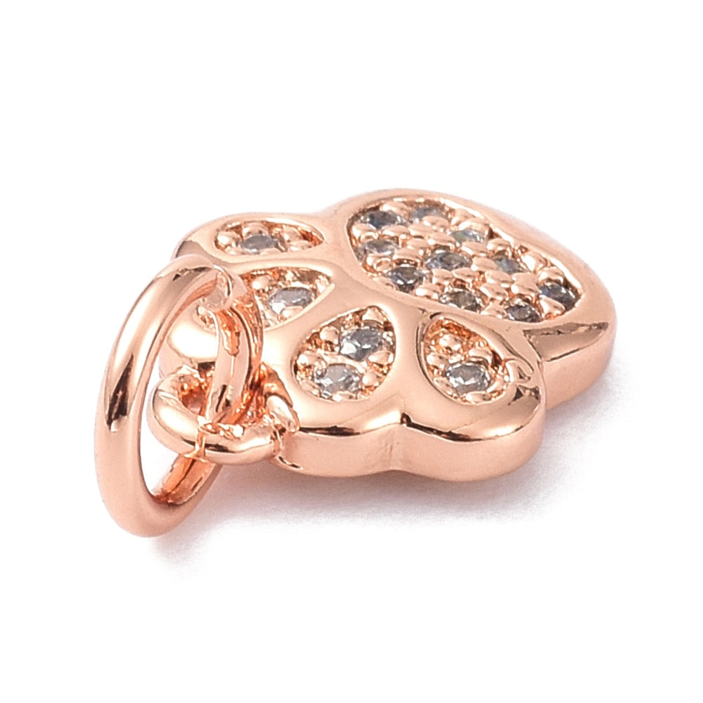 Tassavtrycksformad berlock med mikroinfattade cubic zirconia i roséguldfärg.