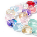 Glaspärlor hjärtformade ca 10mm transparent färgmix, 1 sträng (33cm)