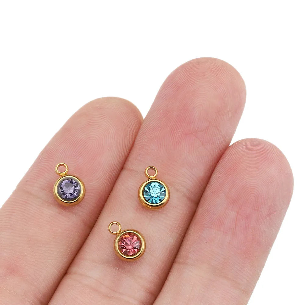 Rund berlock 6mm i rostfritt stål och klar strass gyllene, 2-pack