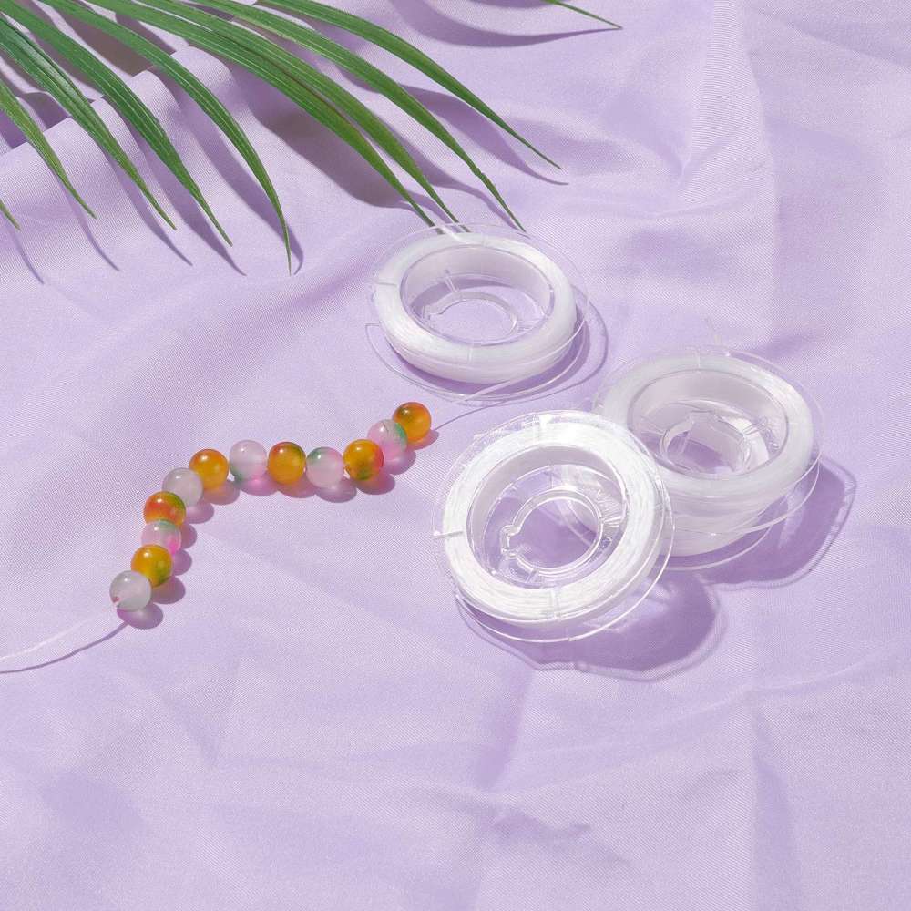 Elastisk Platt Smyckestråd 0,8mm Vit, 1 rulle med 10 meter