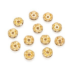 Strassrondeller Vågig kant 8mm Gyllene med Klar sten, 10-pack