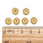 Strassrondeller Vågig kant 8mm Gyllene med Klar sten, 10-pack