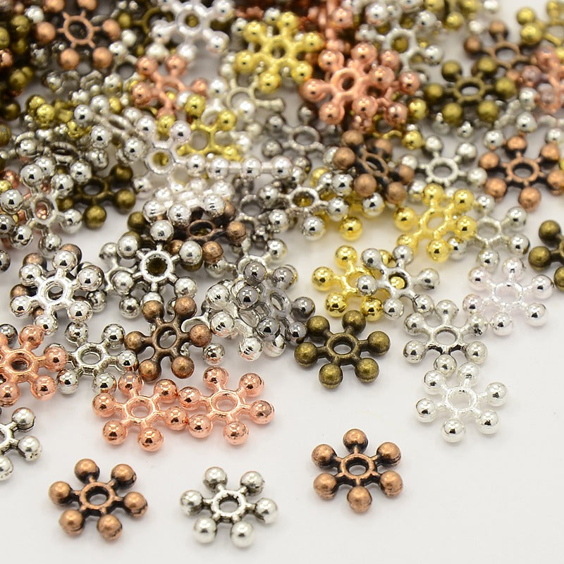 Metallpärlor 8,5mm Mix Mellanrondeller Snöflingor Daisys Glorior, 50-pack
