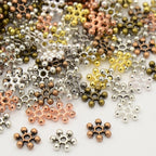 Metallpärlor 8,5mm Mix Mellanrondeller Snöflingor Daisys Glorior, 50-pack