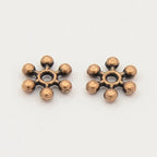 Metallpärlor 8,5mm Mix Mellanrondeller Snöflingor Daisys Glorior, 50-pack