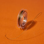 Tigertail Wiretråd Smyckestråd Rostfritt Stål 0,38mm Goldenrod, 1 rulle (10 meter)